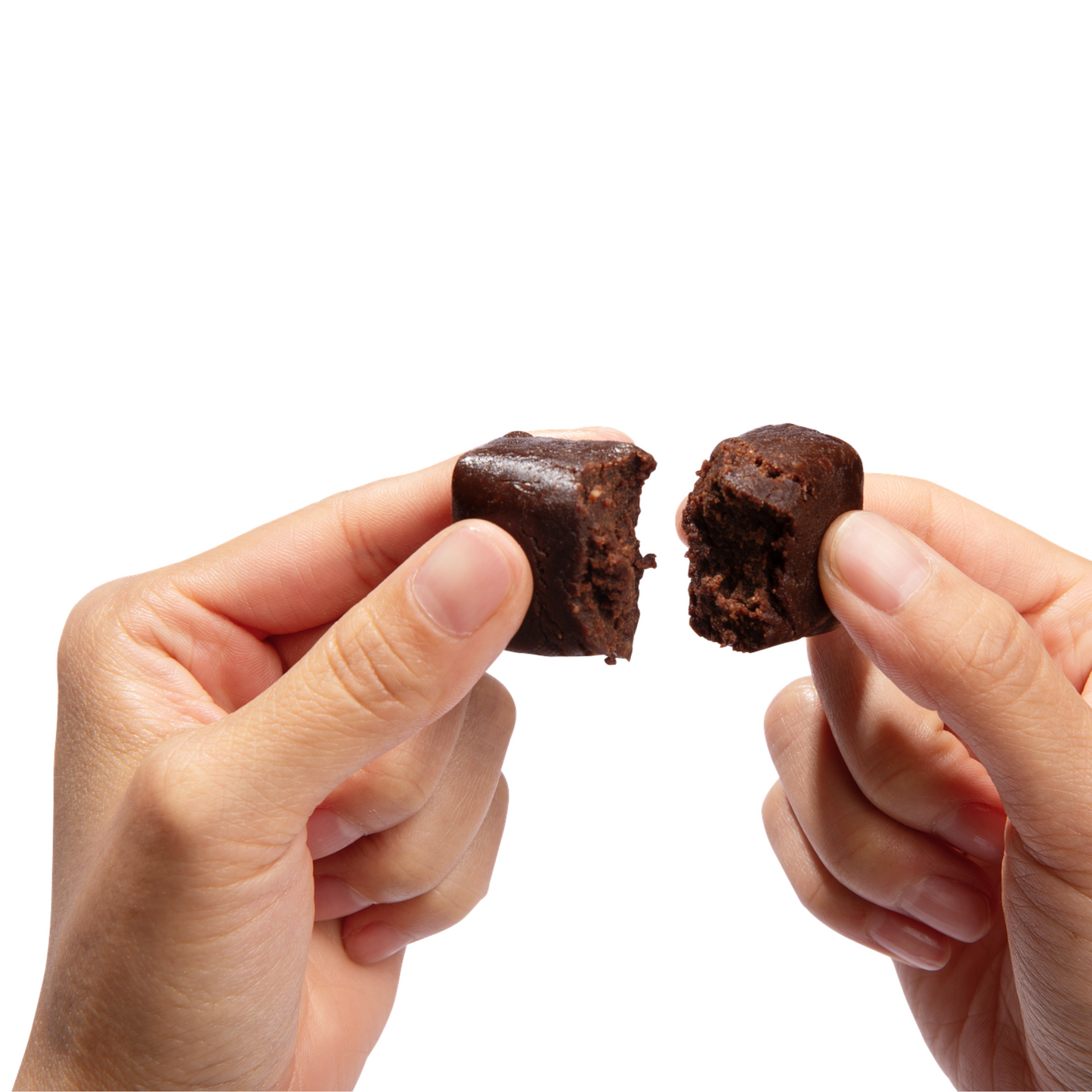 Hands breaking apart a Superfood Bite