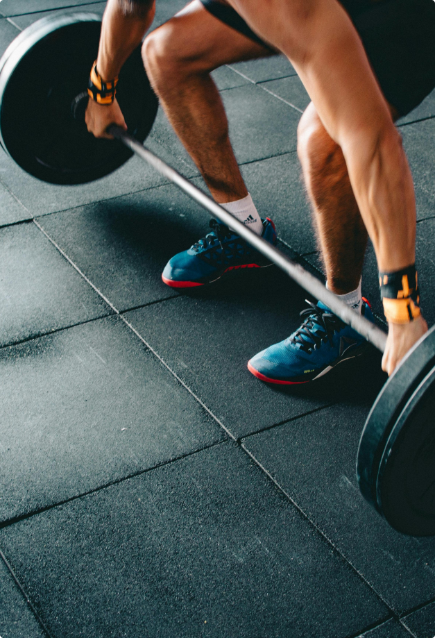 photo of man lifting weights