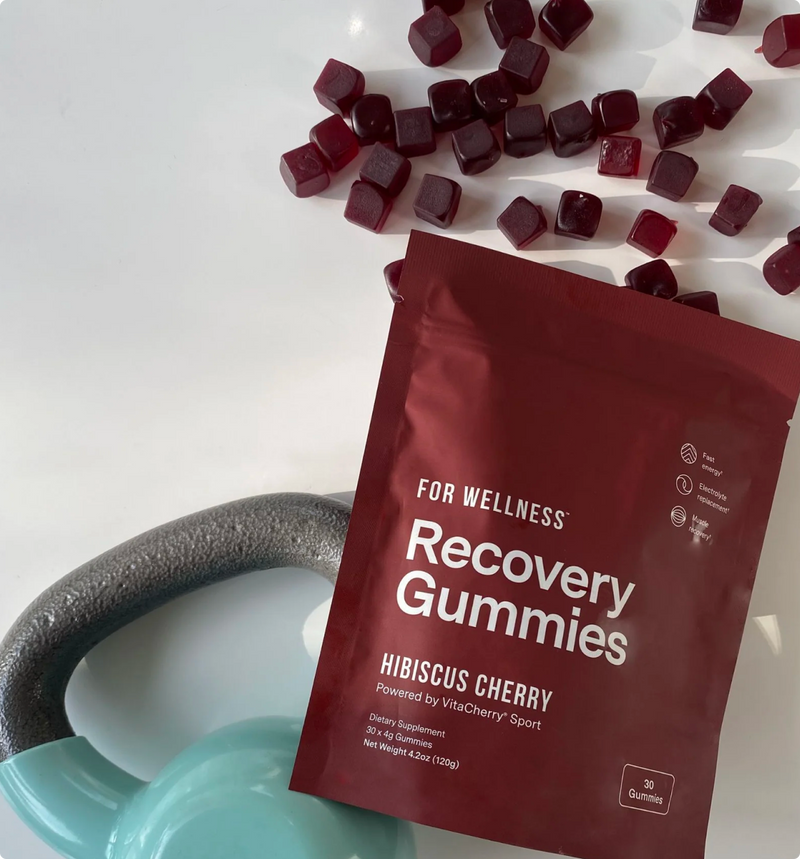 Recovery Gummies Restore on top of a kettlebell