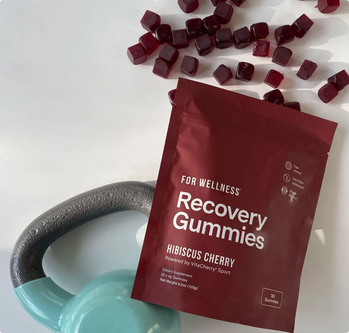 Photo of Recovery Gummies Restore with a blue kettlebell