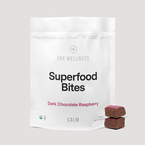 Superfood Bites Calm Dark Chocolate Raspberry pouch with two stacked bites, 10-count 220g bag