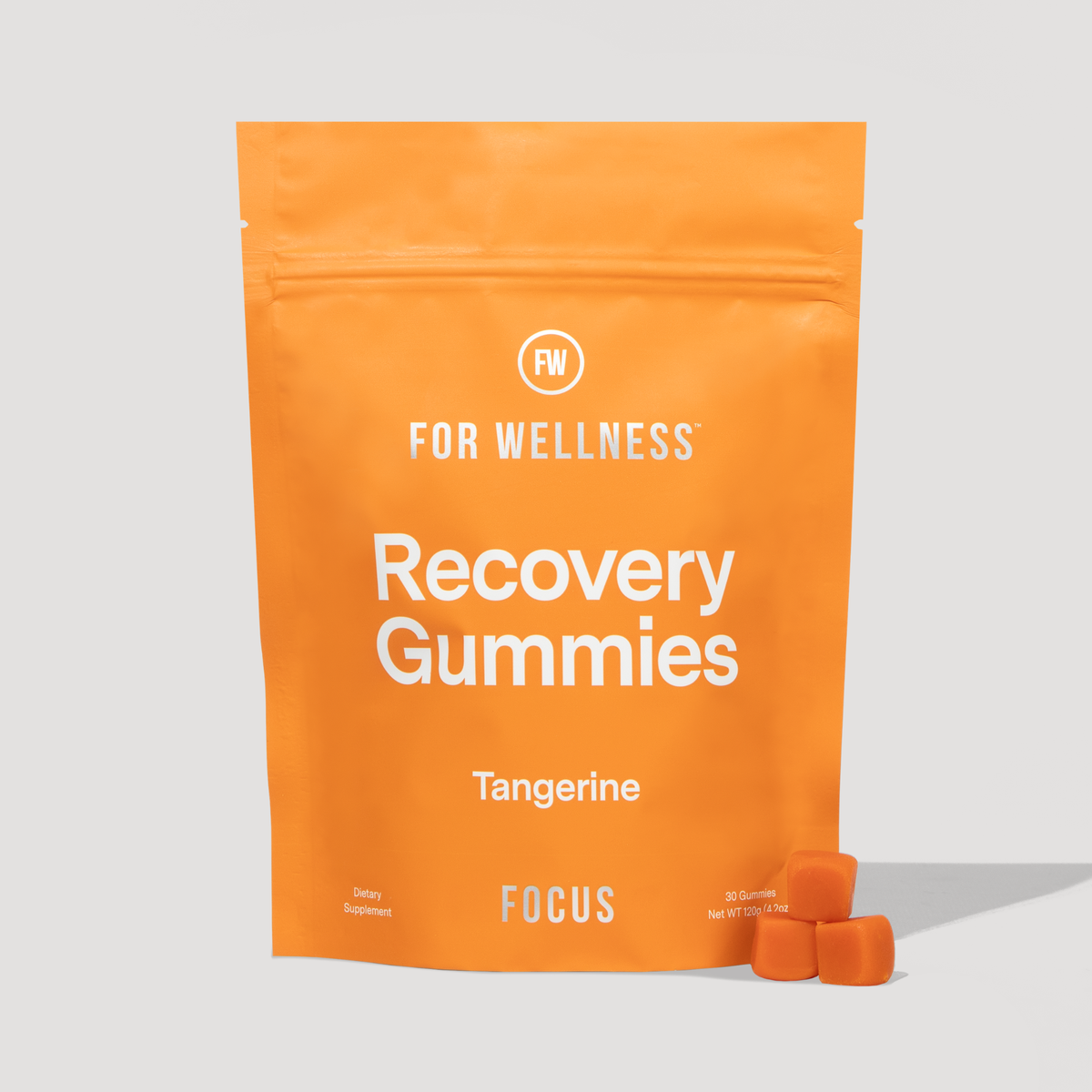Focus Recovery Gummies pouch in Tangerine flavor with three orange gummies beside it