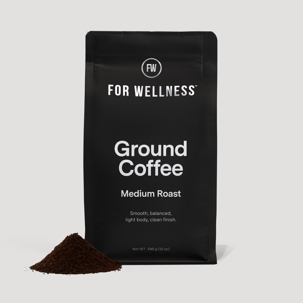 For Wellness Ground Coffee Medium Roast bag with a pile of ground coffee