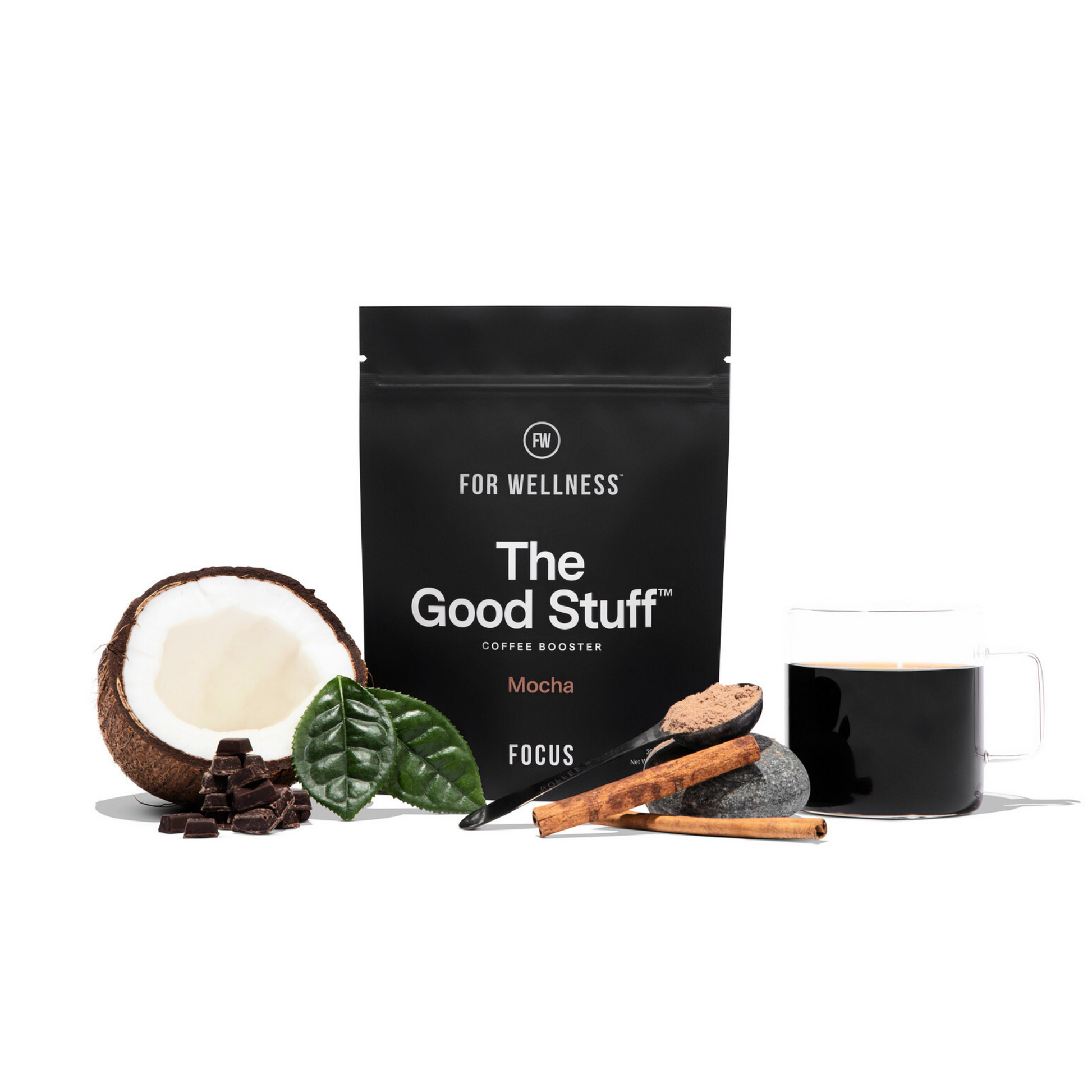 The Good Stuff Focus pouch surrounded by coffee. cinnamon, cocoa, coconut, and a scoop 