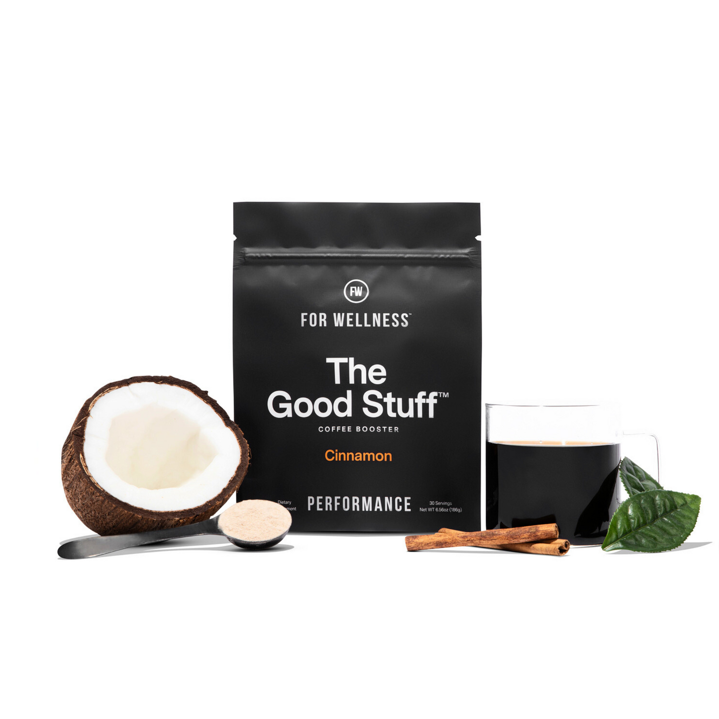 The Good Stuff Performance surrounded by a cup of coffee, cinnamon, coconut, and a scoop