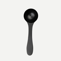 Black stainless steel scoop for The Good Stuff coffee booster, included in the 90-Day welcome kit